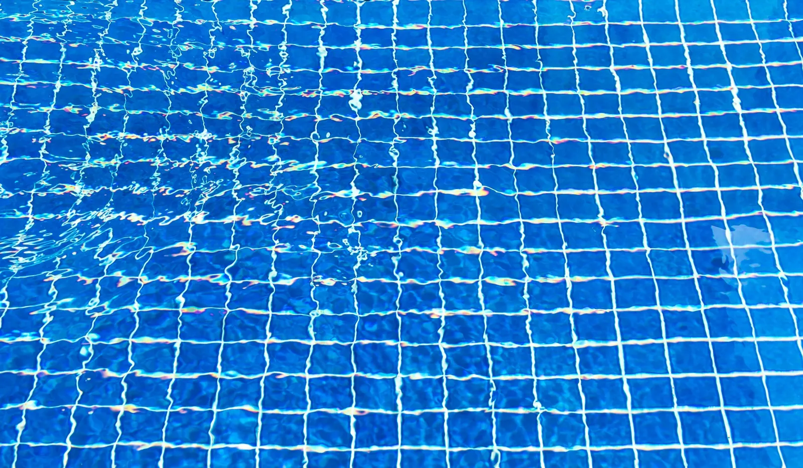 Pool builder craftsmanship in Aubrey, TX — attention to tile, coping, and finish detail