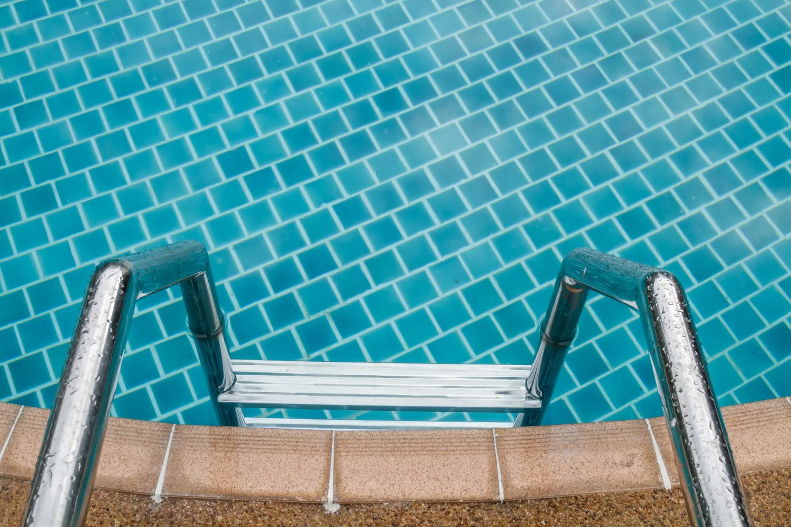 Aubrey, TX pool remodel with new tile, coping, and modern plaster finish